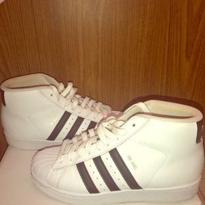 High top Adidas sneakers in great condition.